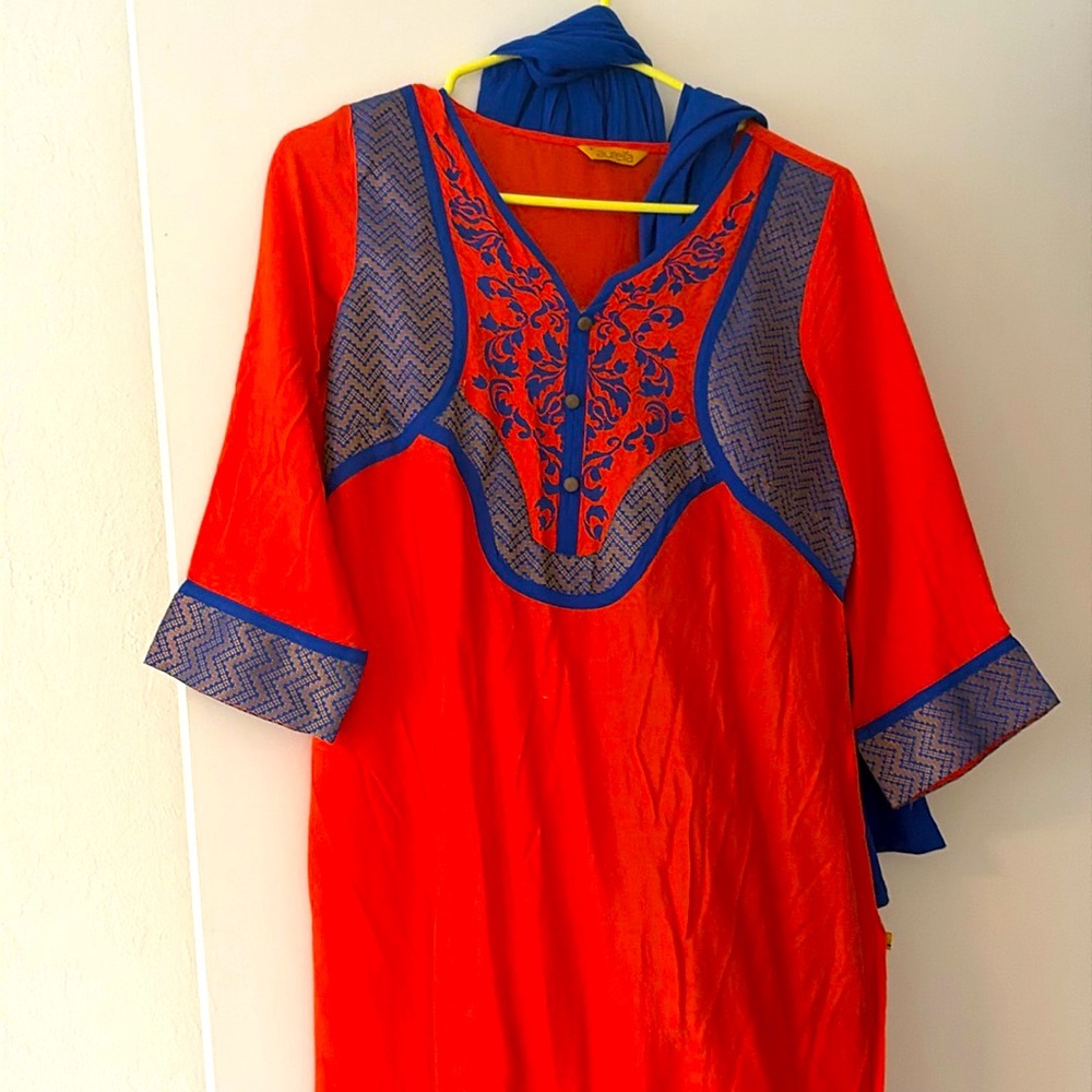 Orange and blue salwar set with blue leggings and dupatta.